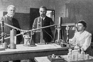 ilustracja marii curie-sklodowskiej z mezem w laboratorium